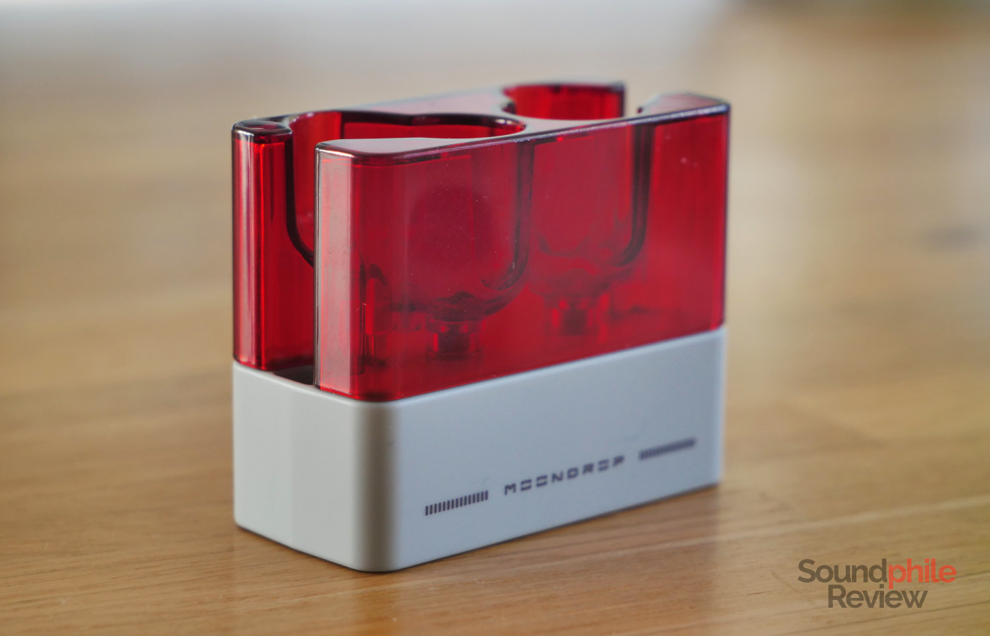 The Moondrop Ultrasonic's case is half transparent red plastic